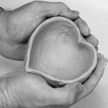closeup shot of a heart shaped clay pot