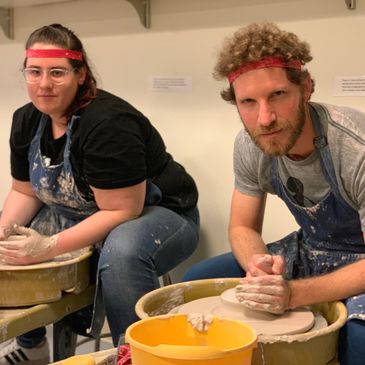 a man and woman at Adult pottery wheel classes