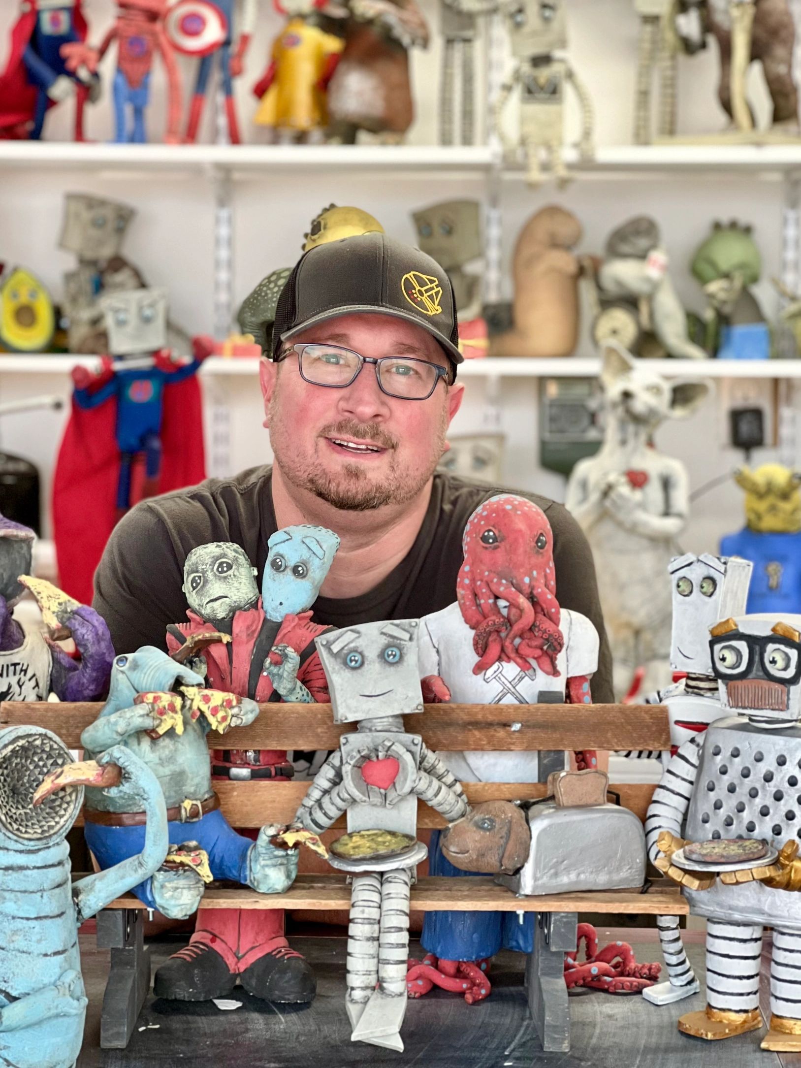 Joshua Margolis and some of his clay creations