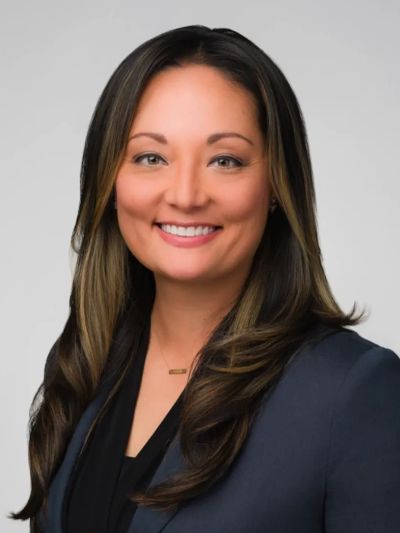 Professional woman smiling in a business portrait.