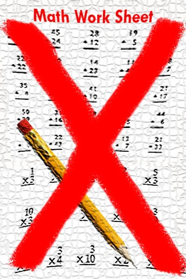 Math work sheet and pencil, with a large painted red X Diagonally crossing the four corners of the p