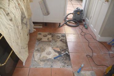 Bad kitchen floor tile job repair done for a customer of mine, showcasing pour craftsmanship
