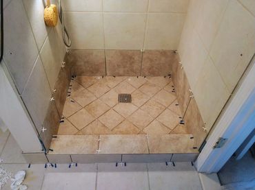 Restored shower pan, fully waterproofed, returning it to its original state for enhanced performance