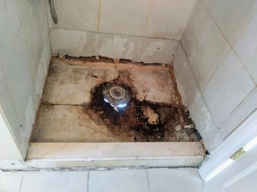 Timber rotted away from water leakage causing catastrophic shower failure needing urgent repair