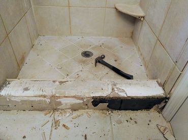 Water damaged shower leak repair in Brownstown, MI, showcasing tools and pour craftsmanship