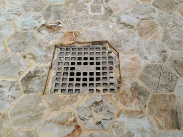 Poorly executed tile job in Northville, MI, done by cowboy builders, highlighting poor tiling skill