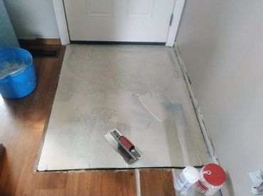 Buttering entire surface with thin set adhesive it is a must before applying an uncoupling membrane