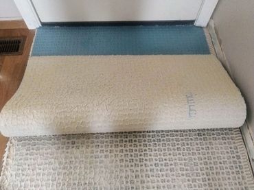 Installing uncoupling membrane on top of the old school mud set subfloor to prevent future cracks