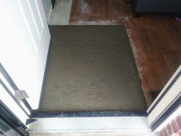 Freshly poured traditional mortar bed (mud set) providing a level and structural subfloor.