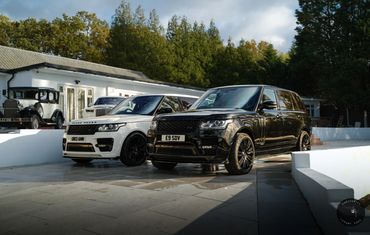 Black and white range rover vogue for hire side view