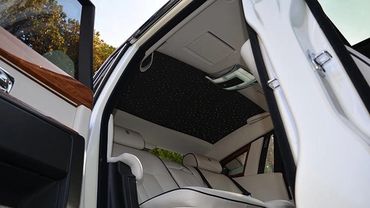 WHITE Rolls Royce Phantom Series 2 Interior adorned with premium leather and wood accents.