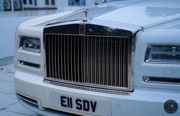 Rolls Royce Phantom 2's classic white exterior, a symbol of luxury and prestige.