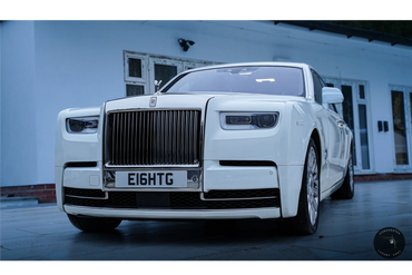 Gleaming white Rolls Royce Phantom 8 making a bold statement.