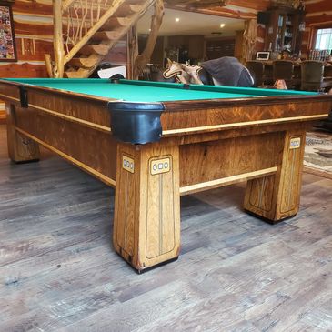 Mid-century modern billiard table in a rustic hunting lodge in the Poconos