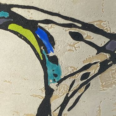 Surface detail of a mono print on clay design. Black fluid lines, blue and green accents