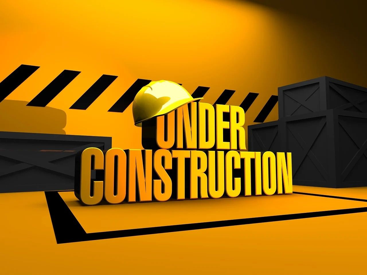 Bright yellow under construction sign with helmet and crates.