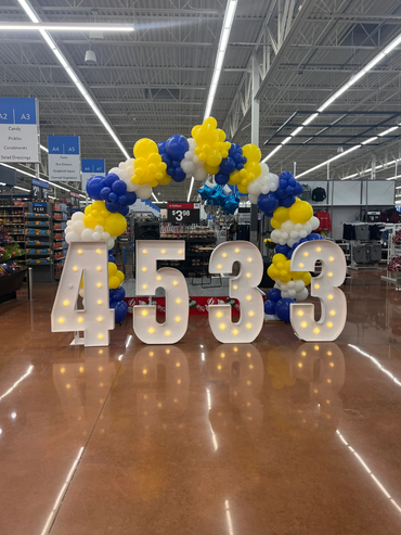 organic balloon arch with light up number rentals