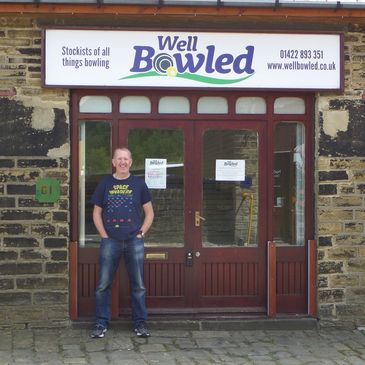 shop manager standing outside the well bowled shop