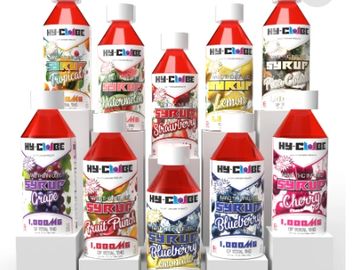 Assorted flavors of Hy-Choice syrup bottles displayed in rows.