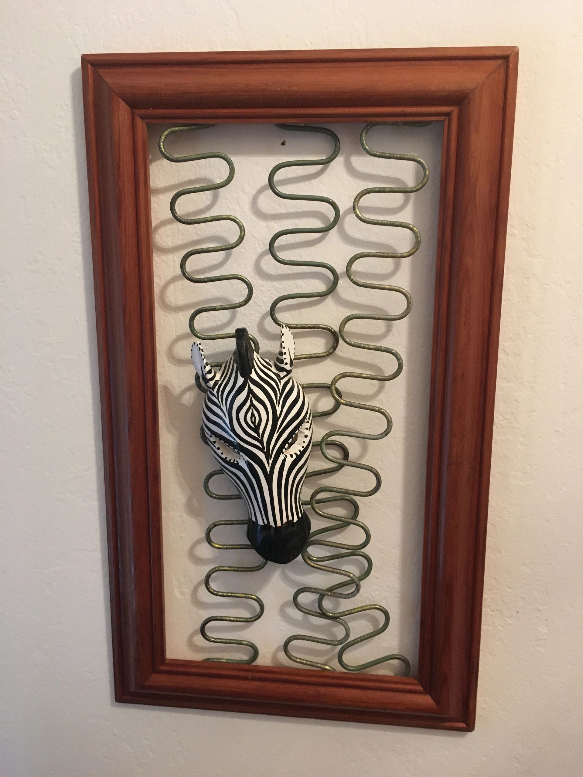 wooden zebra mask mounted on reclaimed upholstry chair springs fixed in reclaimed pine frame