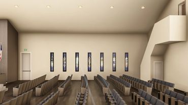 Interior of a modern church with wooden pews and stained glass windows.