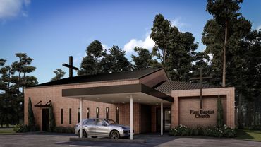 Modern brick First Baptist Church building with crosses and a car parked outside.