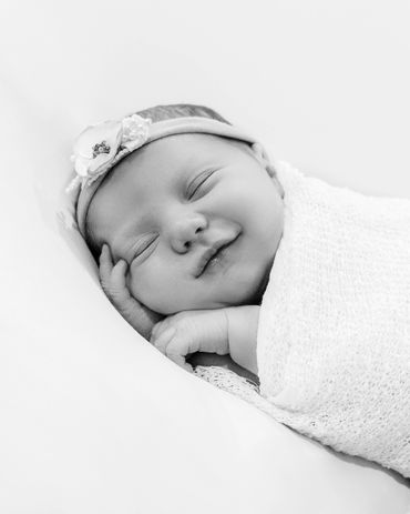 black and white, smiling, sleeping baby girl