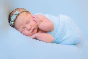 infant sleeping baby girl in blue