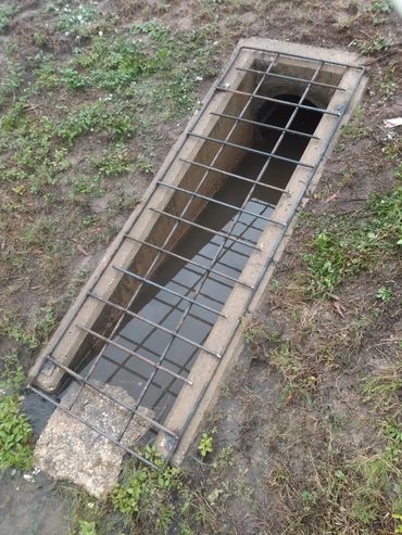 storm drain grate made of steel rebar.