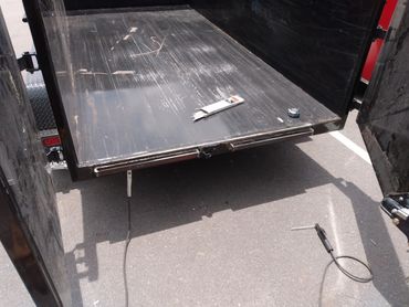 Trailer ramp slots