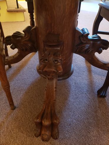 loin head, and footed wooden tables in dining area