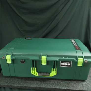 Green Pelican Air protective case with bright green latches and handle.