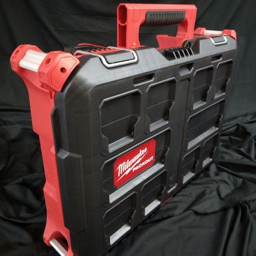Milwaukee Packout tool storage case with red and black design.