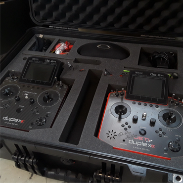 Two Jeti DS-24 radio control transmitters in a protective foam case.