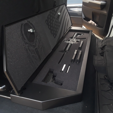 Gun case with firearms and magazines inside a vehicle.