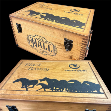 Wooden box with horse silhouettes and the name 'Hall' engraved.
