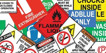 A cluster of various safety and warning signs with bold symbols and colors.