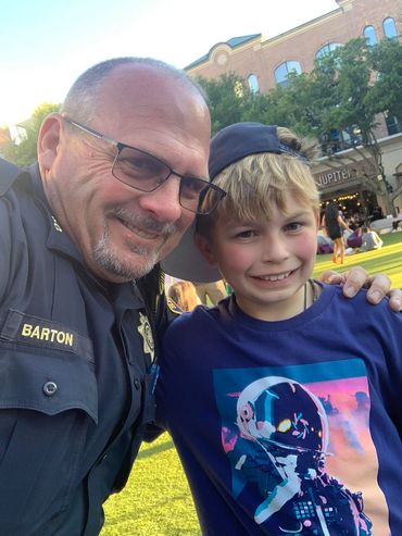 A man and boy posing for the camera.