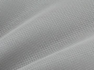 Close-up of light gray textured fabric with fine weave.