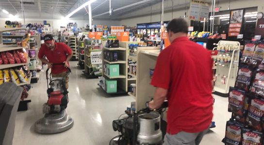 2 Commercial clean employees professionally buffing a floor to improve gloss as part of our service.