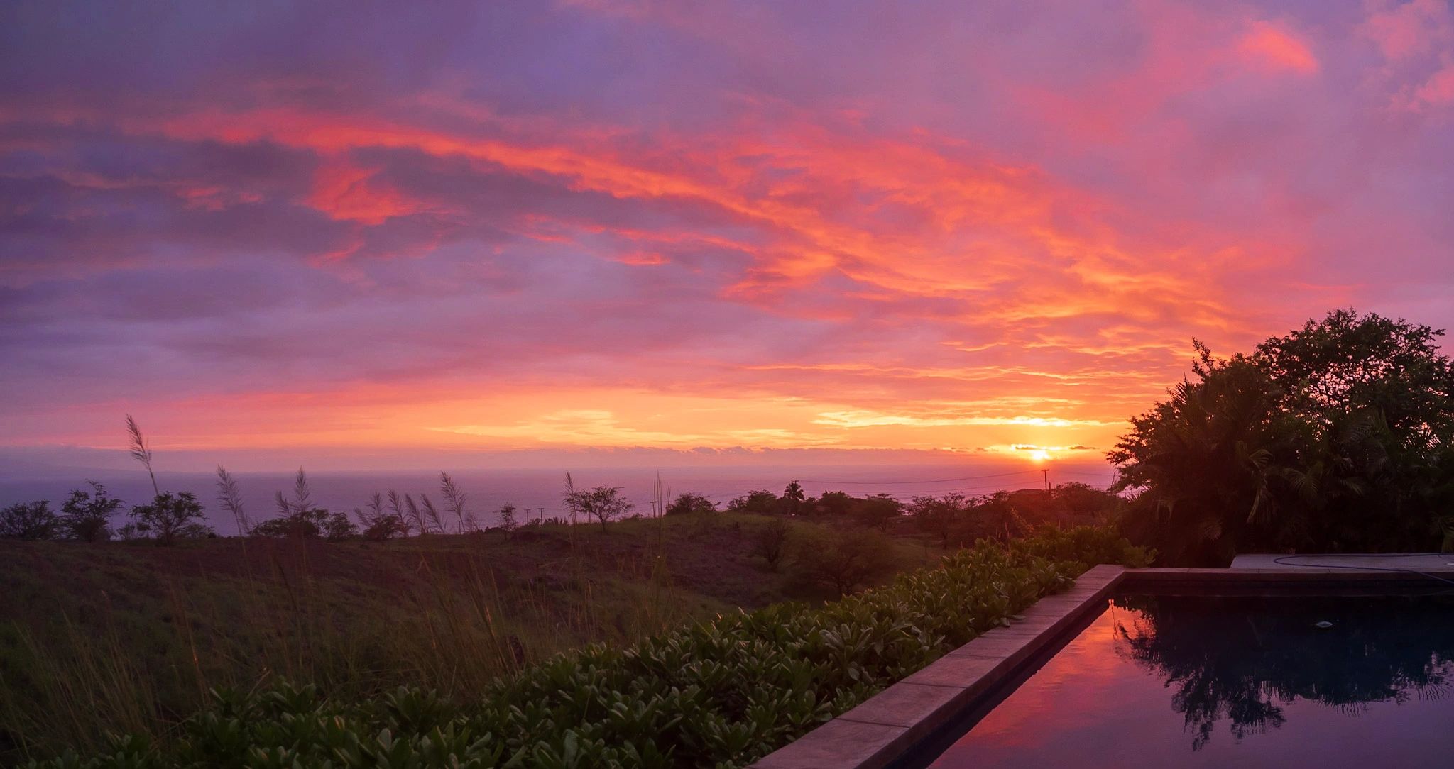 Sunset from the salt water pool at the vacation rental