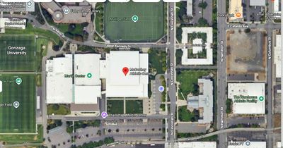 Aerial view of a university campus with labeled buildings and sports fields.