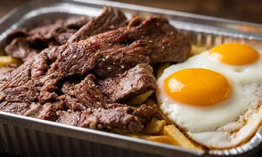 Long Ave BBQ Portuguese Steak Style served with fried eggs over crispy fries in a takeout tray, Hill
