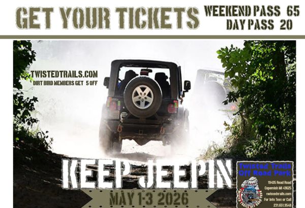 Jeep driving off-road through dusty trail for Twisted Trails event.