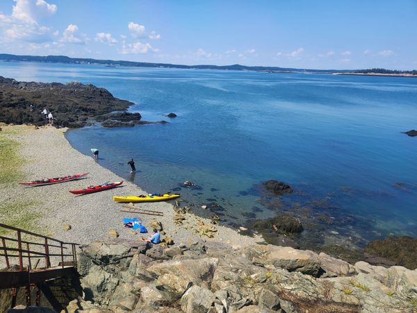 Kayakers and kayaks on a beach on Campobello Island on the Bay of Fundy 
