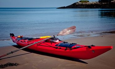 Sea Kayak on Beach with a carbon fibre paddle