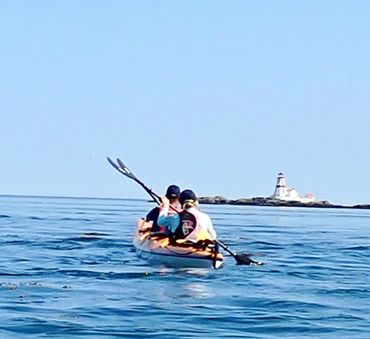Kayakers in a tandem kayak headed to Campobello