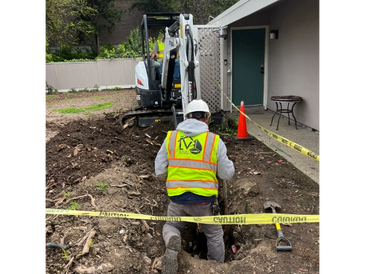A technician reads an instruction manual while servicing or installing