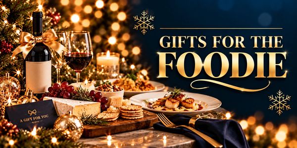 Festive gourmet spread with wine, cheese, and seafood labeled 'Gifts for the Foodie'.