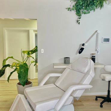 The Skin Tune treatment chair with greenery and equipment in Ramsey.